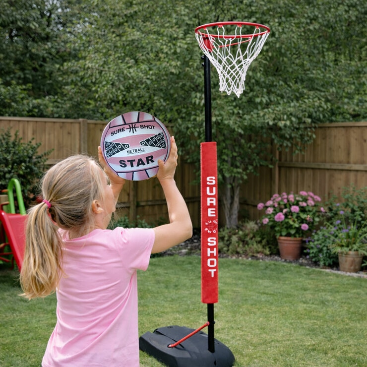 Lifestyle image of a girl throwing the netball at the unit