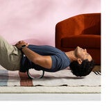 Lifestyle image of a man using a wheel on his back