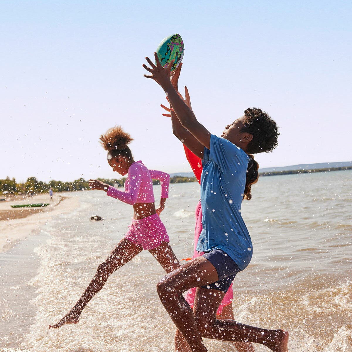Lifestyle image of a boy catching the football