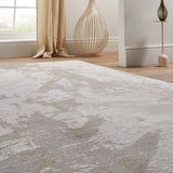 Textured rug in white, beige and light grey with abstract pattern, styled in a minimalist interior.