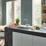 Lifestyle image of supersteel tap in kitchen lifestykle setting