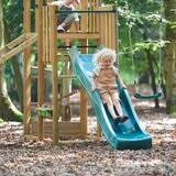 Lifestyle image of a child going down the slide Lifestyle image of a child going down the slide