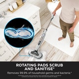 Lifestyle image of Shark Steam & Scrub Automatic Steam Mop with Steam Blaster showing rotating pads