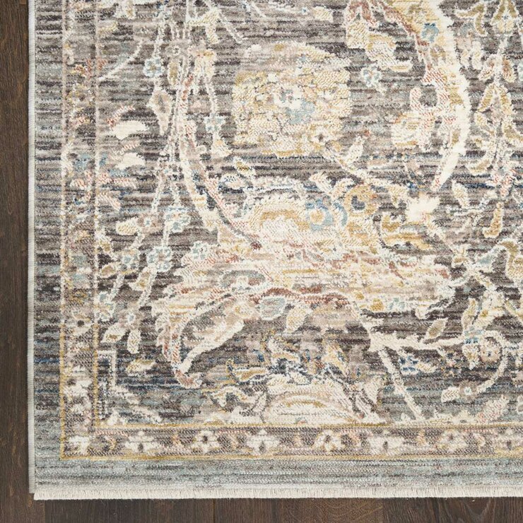 Grey and beige rug with detailed symmetrical pattern and vintage-style accents
