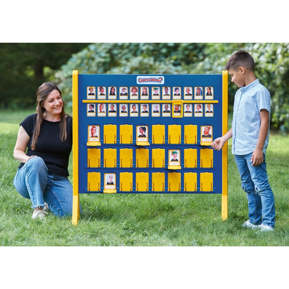 Lifestyle image of a woman and child playing Guess Who? game