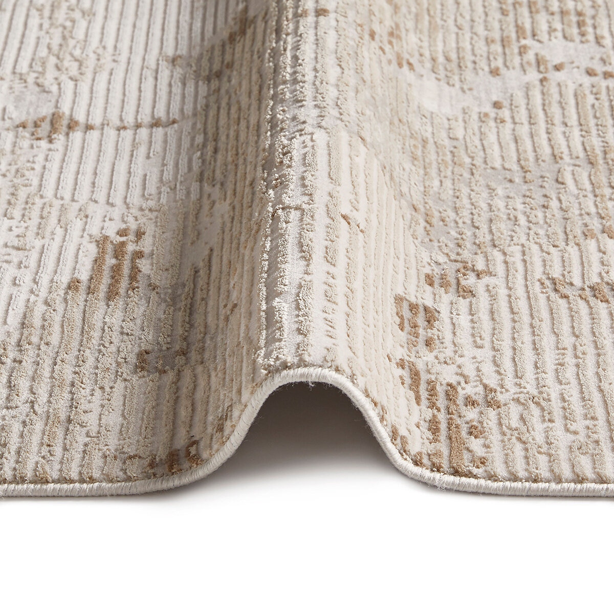 Neutral abstract rug with stone-like pattern in beige, taupe and off-white.