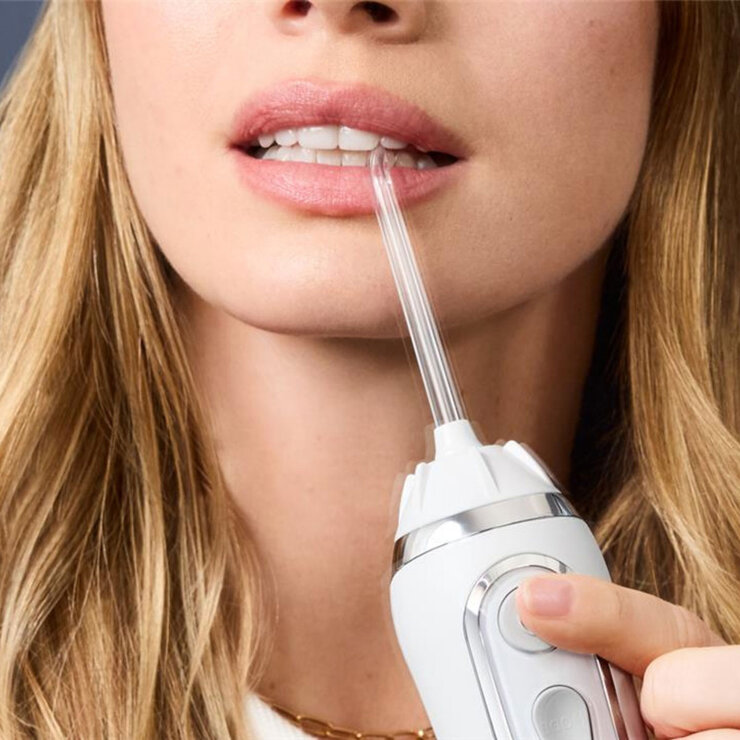 Model using Waterpik Water Flosser Plus