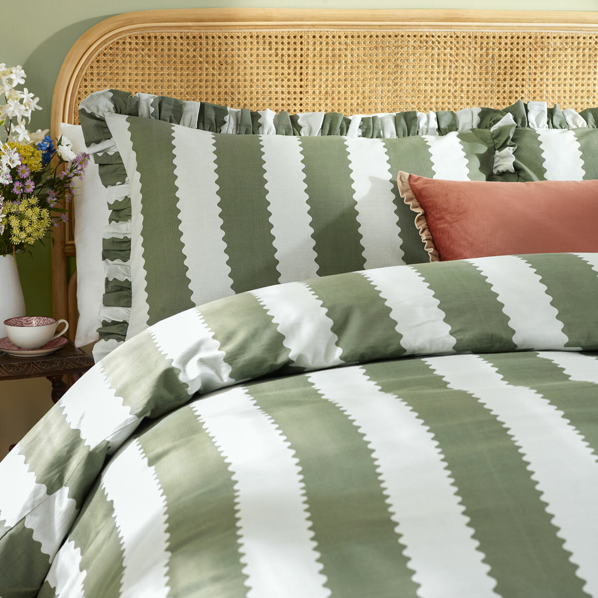 Green and white striped duvet set with scalloped detailing and matching pillow shams. Green and white striped duvet set with scalloped detailing and matching pillow shams.