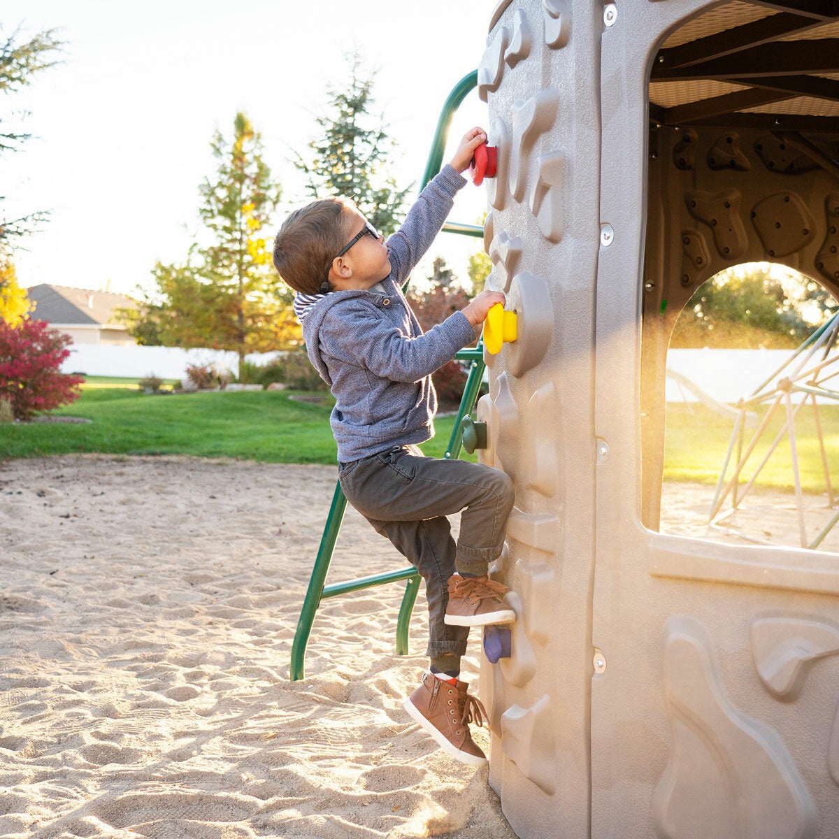 Lifestyle iamge of a child climbing the rock wall Lifestyle iamge of a child climbing the rock wall