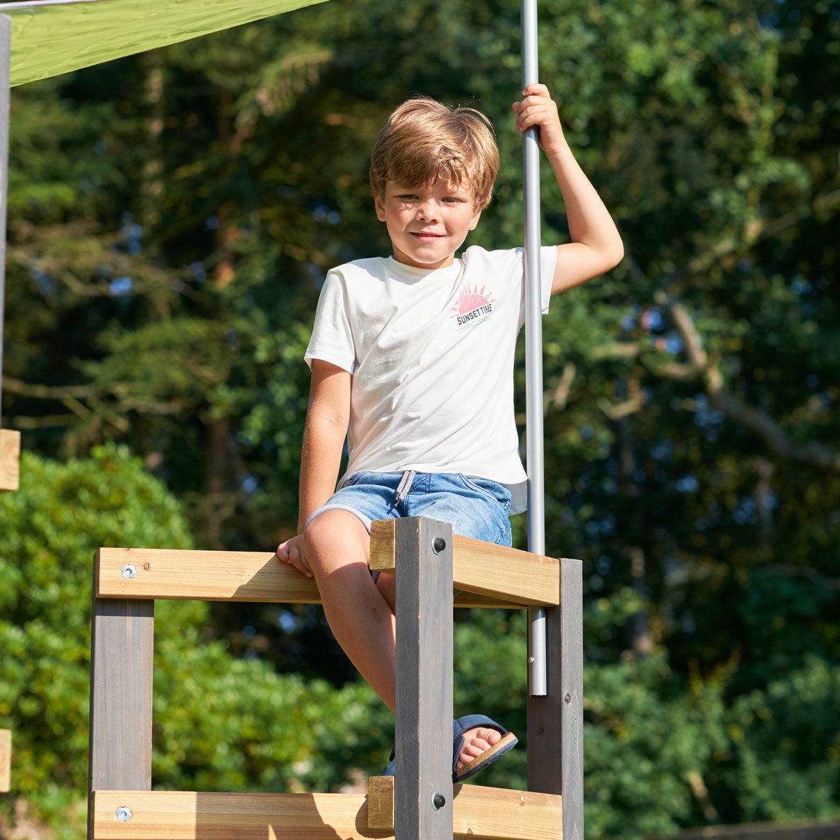 A lifestyle image of a child on the swingset A lifestyle image of a child on the swingset