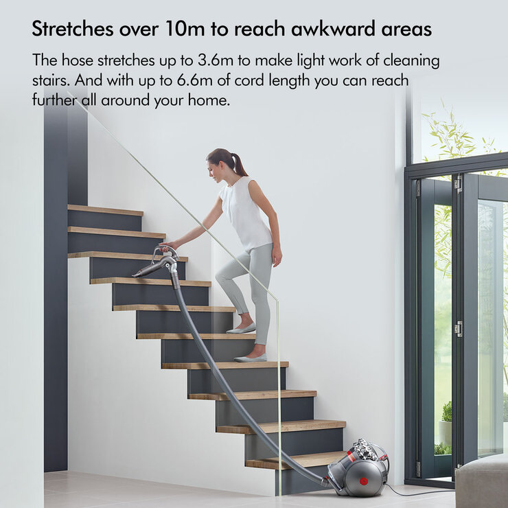 Lifestyle image of Dyson Big Ball Animal 2  showing the hose stretching up to 3.6m