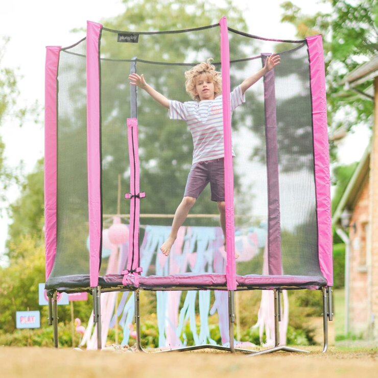 Lifestyle image of a child jumping on the trampoline