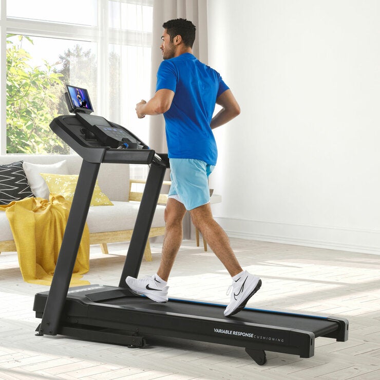 Lifestyle image of a man on the Horizon 5.0AT Treadmill Lifestyle image of a man on the Horizon 5.0AT Treadmill