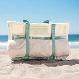 Lifestyle image showing the webbing straps holding a towel Lifestyle image showing the webbing straps holding a towel