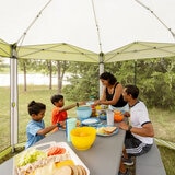 Lifestyle image of people sitting at a table inside the screenhouse Lifestyle image of people sitting at a table inside the screenhouse
