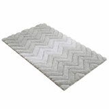 Textured bath mat with soft chevron design