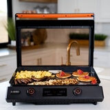 Lifestyle image of electric griddle on kitchen counter with food Lifestyle image of electric griddle on kitchen counter with food