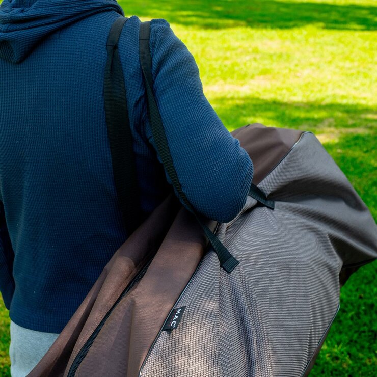 Lifestyle image of someone carrying the carry bag over their shoulder Lifestyle image of someone carrying the carry bag over their shoulder