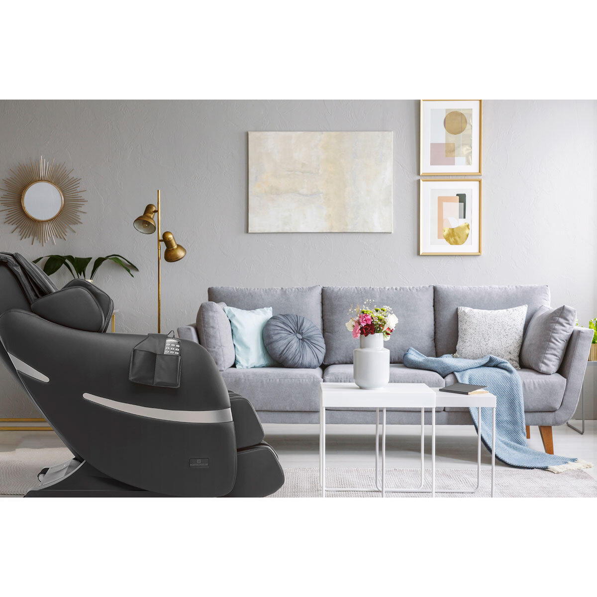 Lifestyle image of Brio+ Massage chair in lounge with light great sofa