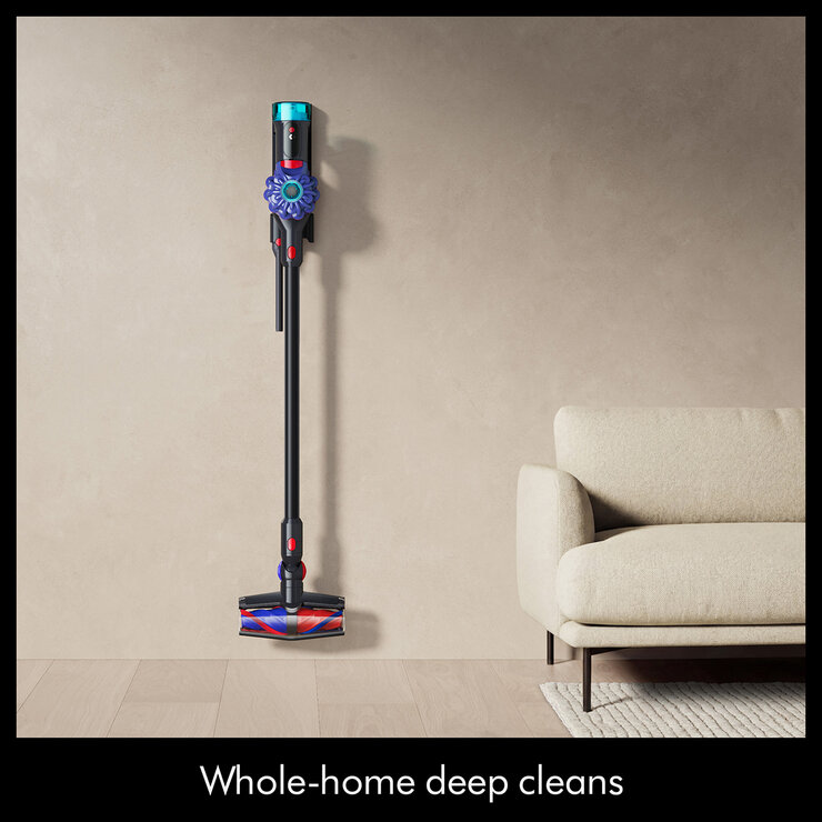 Lifestyle image showing stick vacuum in living room Lifestyle image showing stick vacuum in living room