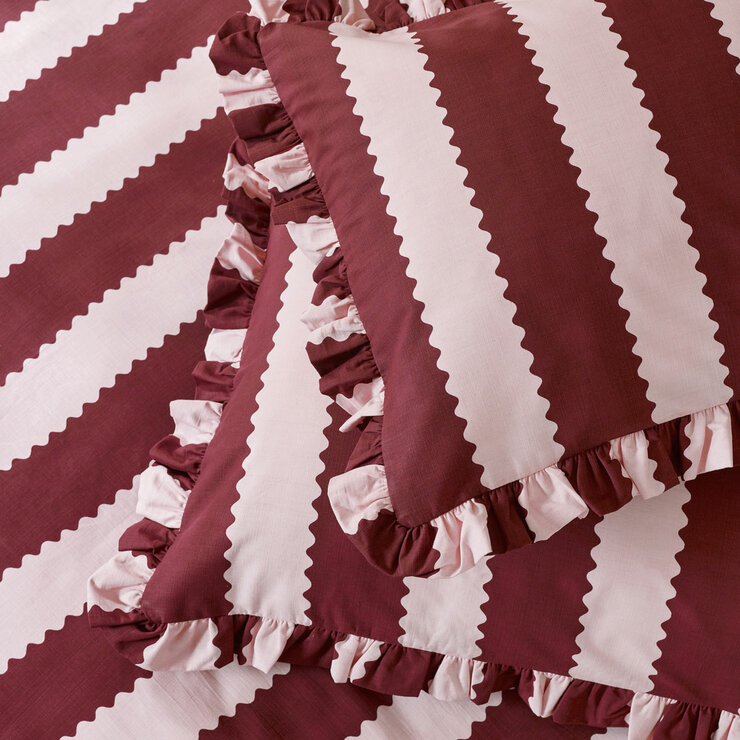 Burgundy and white vertically striped duvet set with ruffled edges and matching pillowcases Burgundy and white vertically striped duvet set with ruffled edges and matching pillowcases