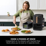 Lifestyle image of Ninja Double Stack 9.5L Air Fryer being used in the kitchen