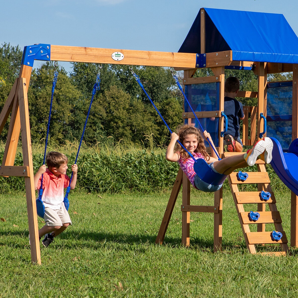 Lifestyle image of two children playing on the swings