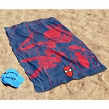 Spiderman character beach towel laid out on sand