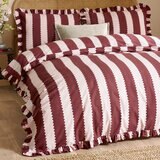 Burgundy and white vertically striped duvet set with ruffled edges and matching pillowcases Burgundy and white vertically striped duvet set with ruffled edges and matching pillowcases