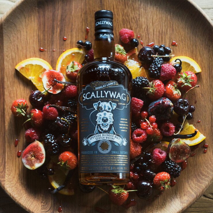Scallywag Whiskey surrounded by fruit Scallywag Whiskey surrounded by fruit