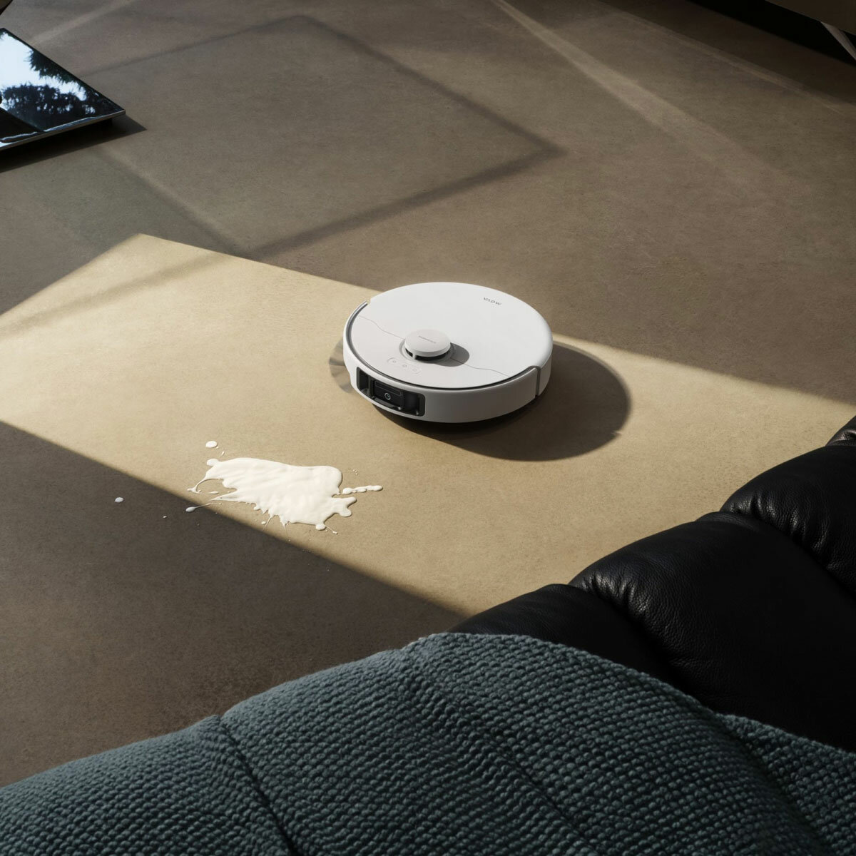 Lifestyle image of MOVA P50 Pro Ultra Robot Vacuum cleaning spill