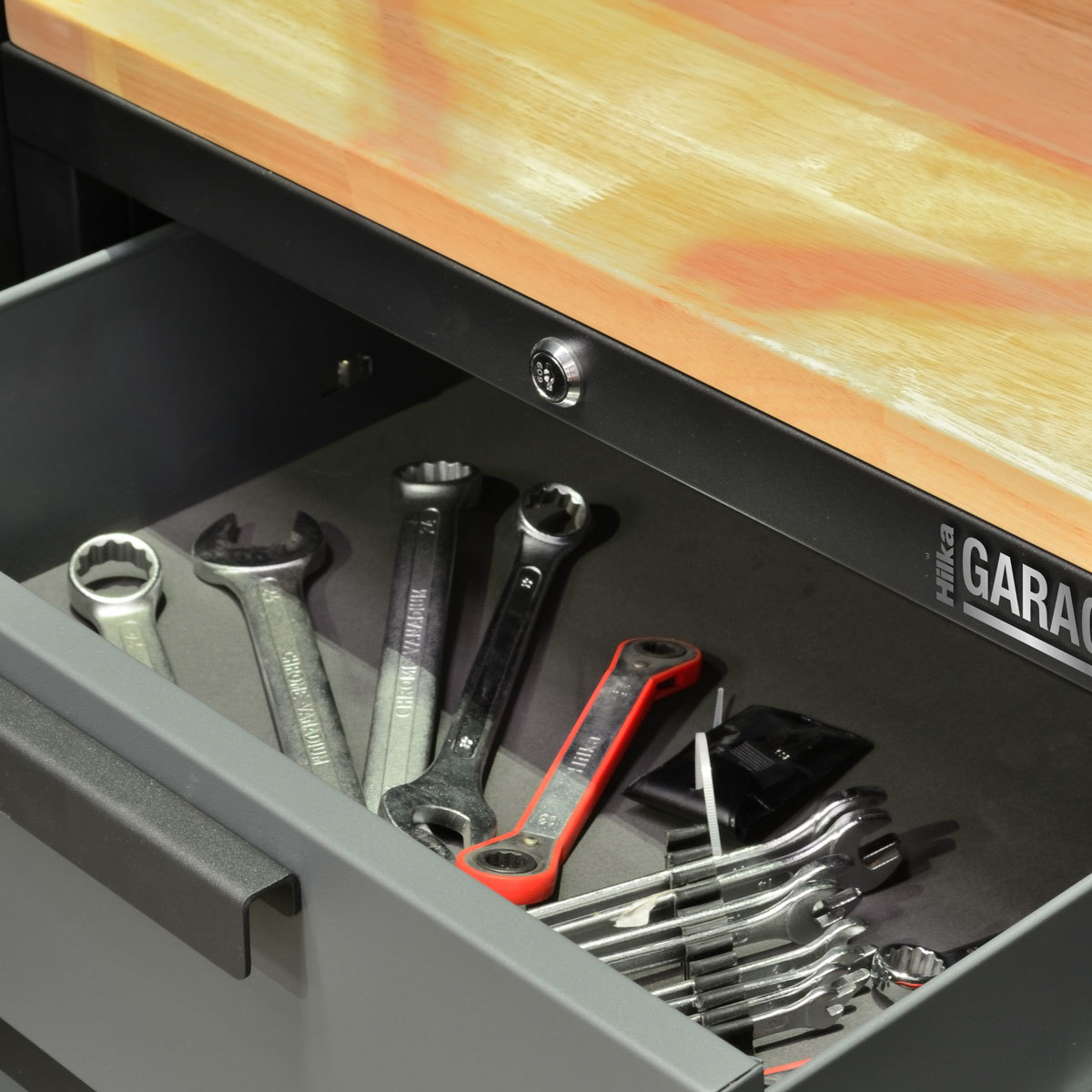 Lifestyle image of open drawer with tools inside (tools not included)