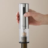Lifestyle image of electric cork screw attachment being used