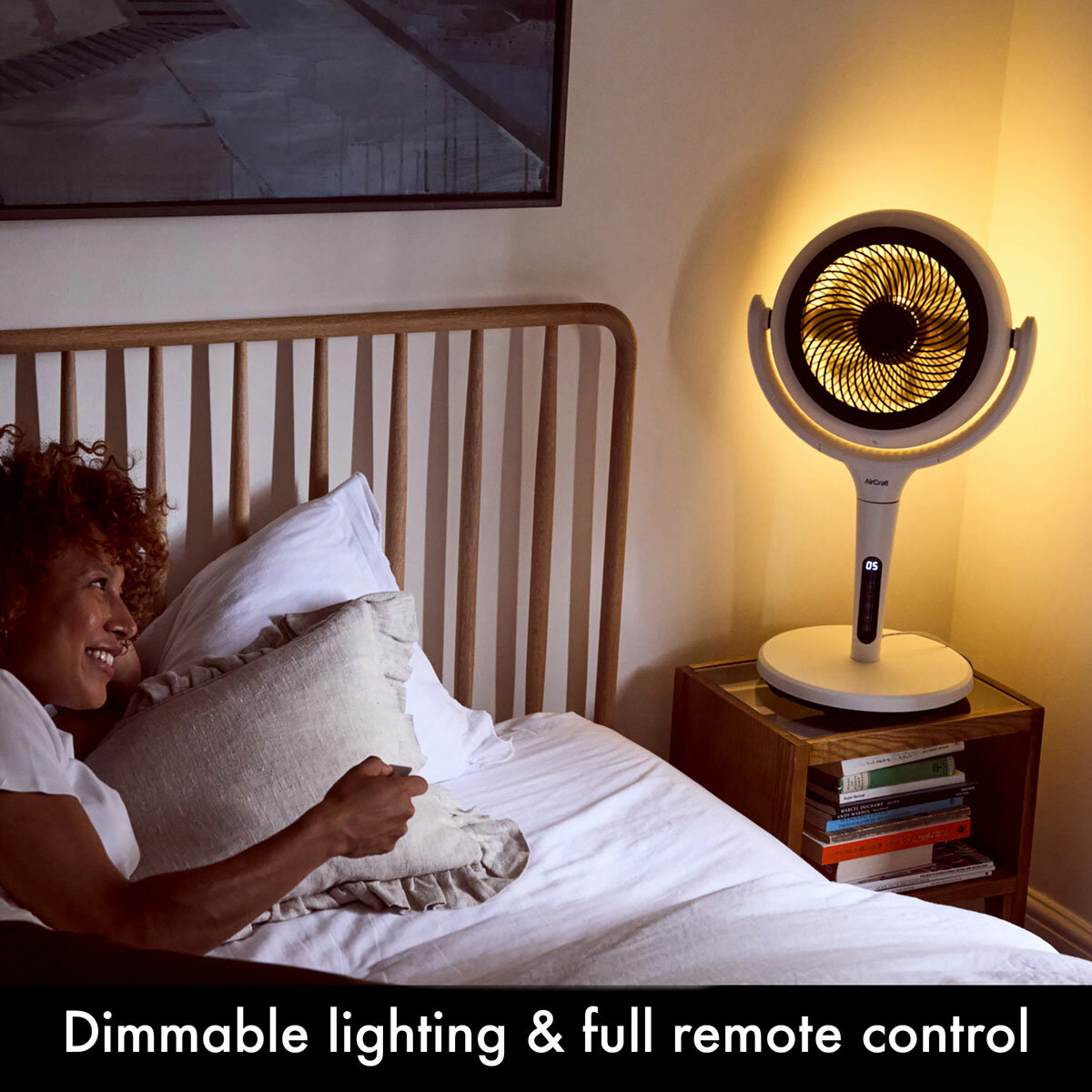 Lifestyle image of  the fan in a bedroom with dimmable lighting and remote control