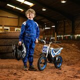 Lifestyle image fo a child next to the Xootz Cobolt Kids Electric Motorbike