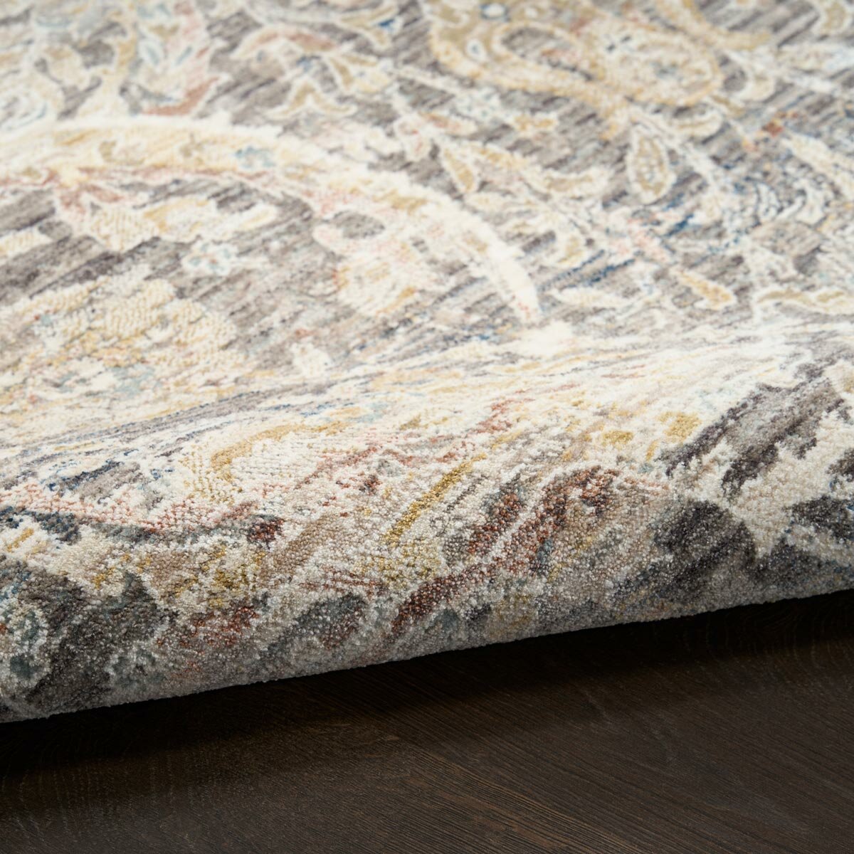 Grey and beige rug with detailed symmetrical pattern and vintage-style accents Grey and beige rug with detailed symmetrical pattern and vintage-style accents