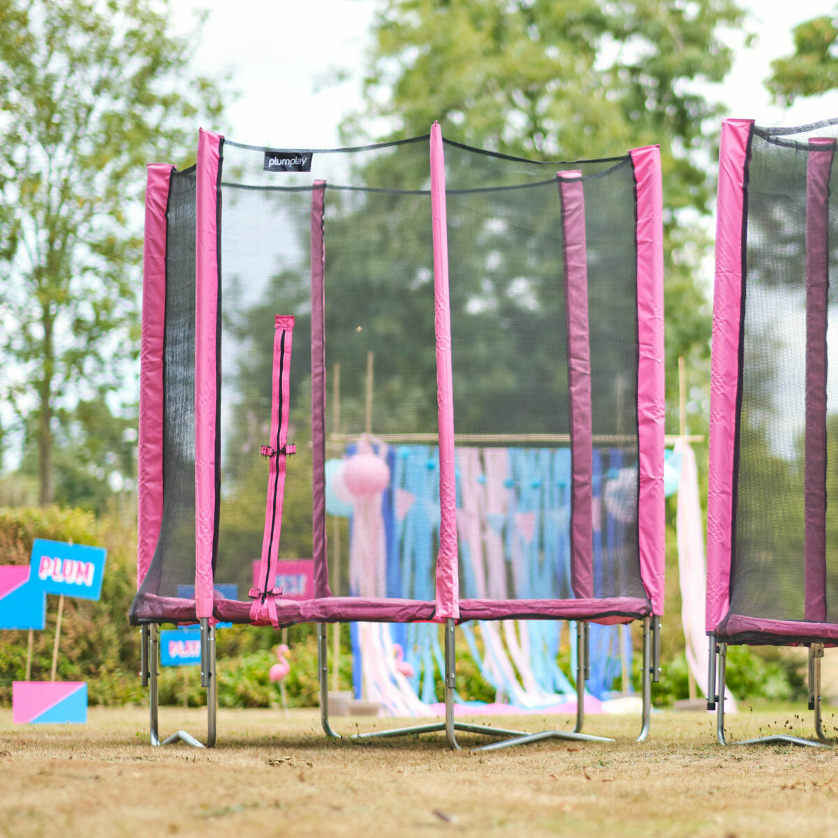 Lifestyle image of the Plum 1.8m Pink Springsafe Trampoline