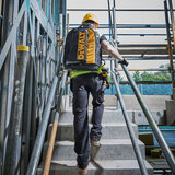 Lifestyle image of backpack beng worn on construction site