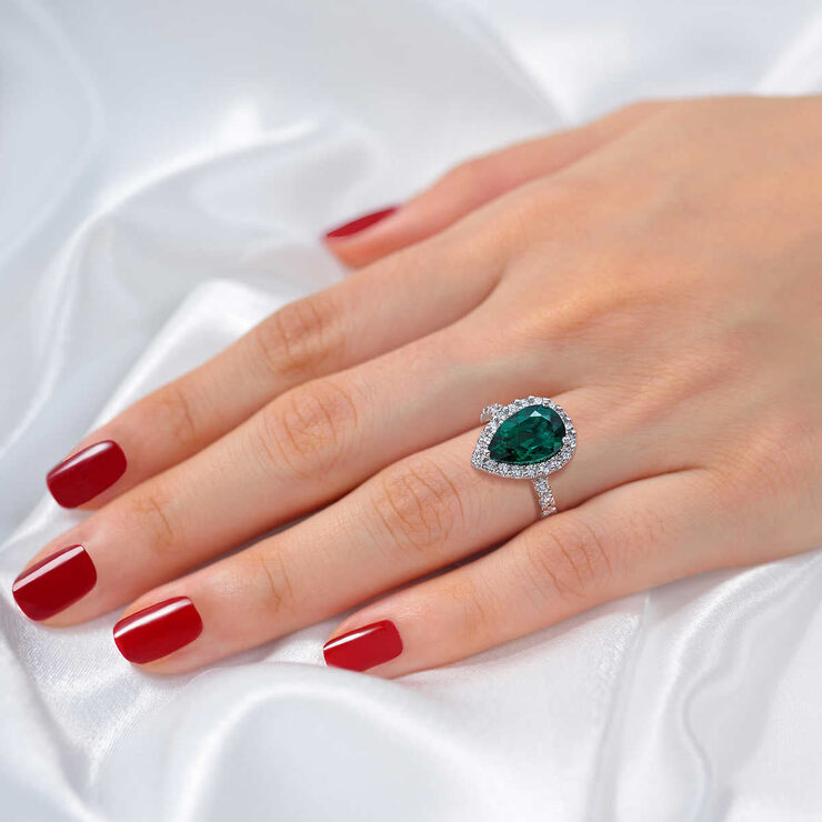 Pear Shaped Lab Emerald and 0.65ctw Diamond Ring.