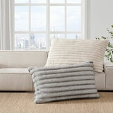 XL ribbed pillows with a plush texture resting on a beige sofa