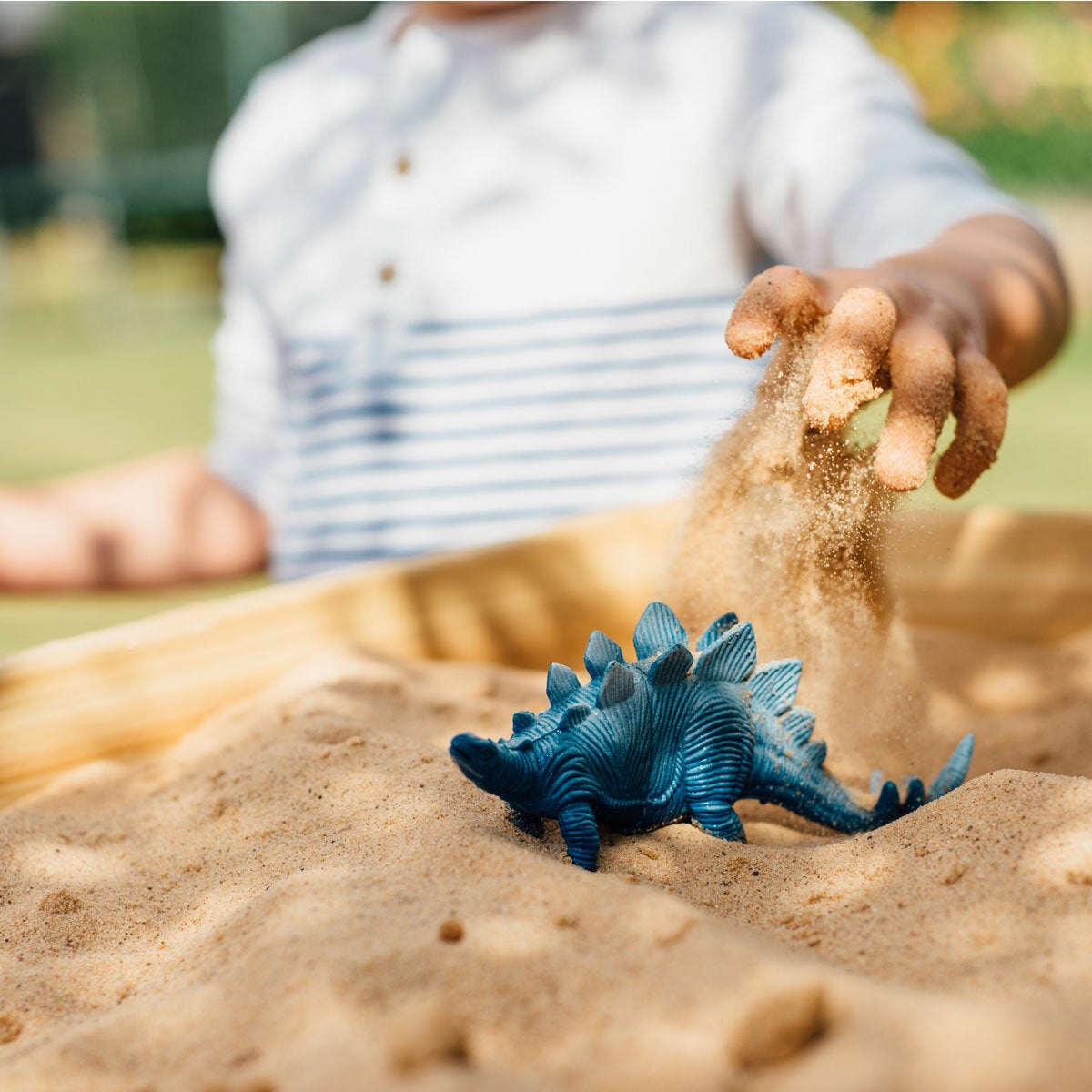 Lifestyle image of a child playing with the sand table Lifestyle image of a child playing with the sand table