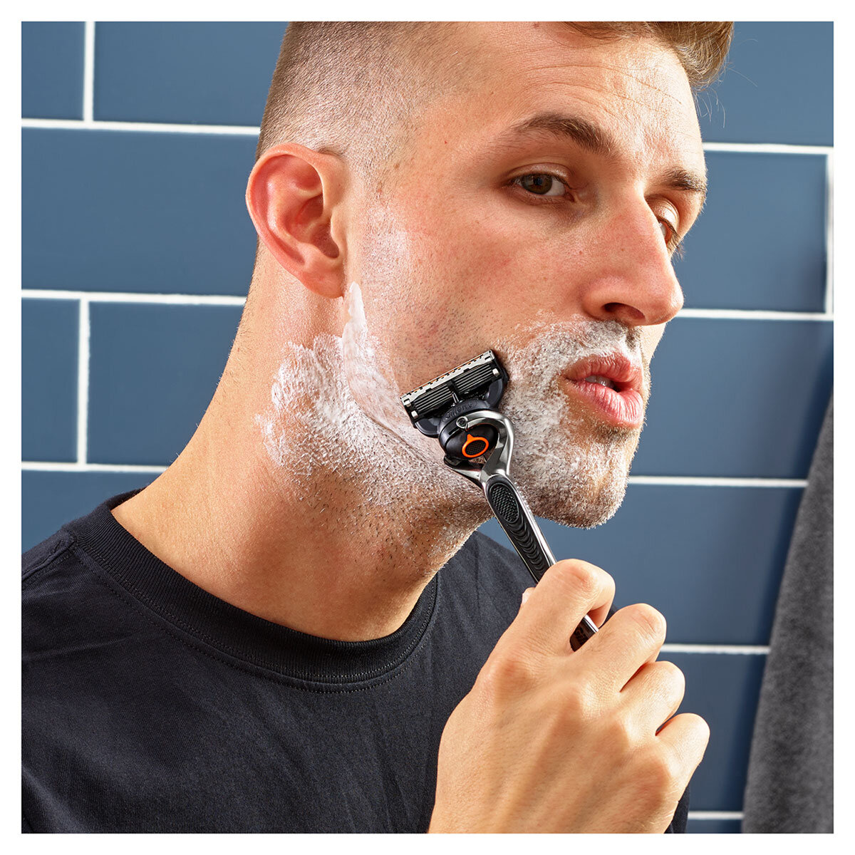 Man shaving face