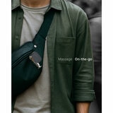 Lifestyle image of Renpho Micro Massage Gun attached to a bag