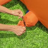 Lifestyle image of a woman setting up the hose