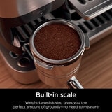 Lifestyle image of  Ninja Luxe Café Pro Espresso Machine showing built in scale