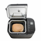 Panasonic Bread Maker with opened lid with baked goods inside
