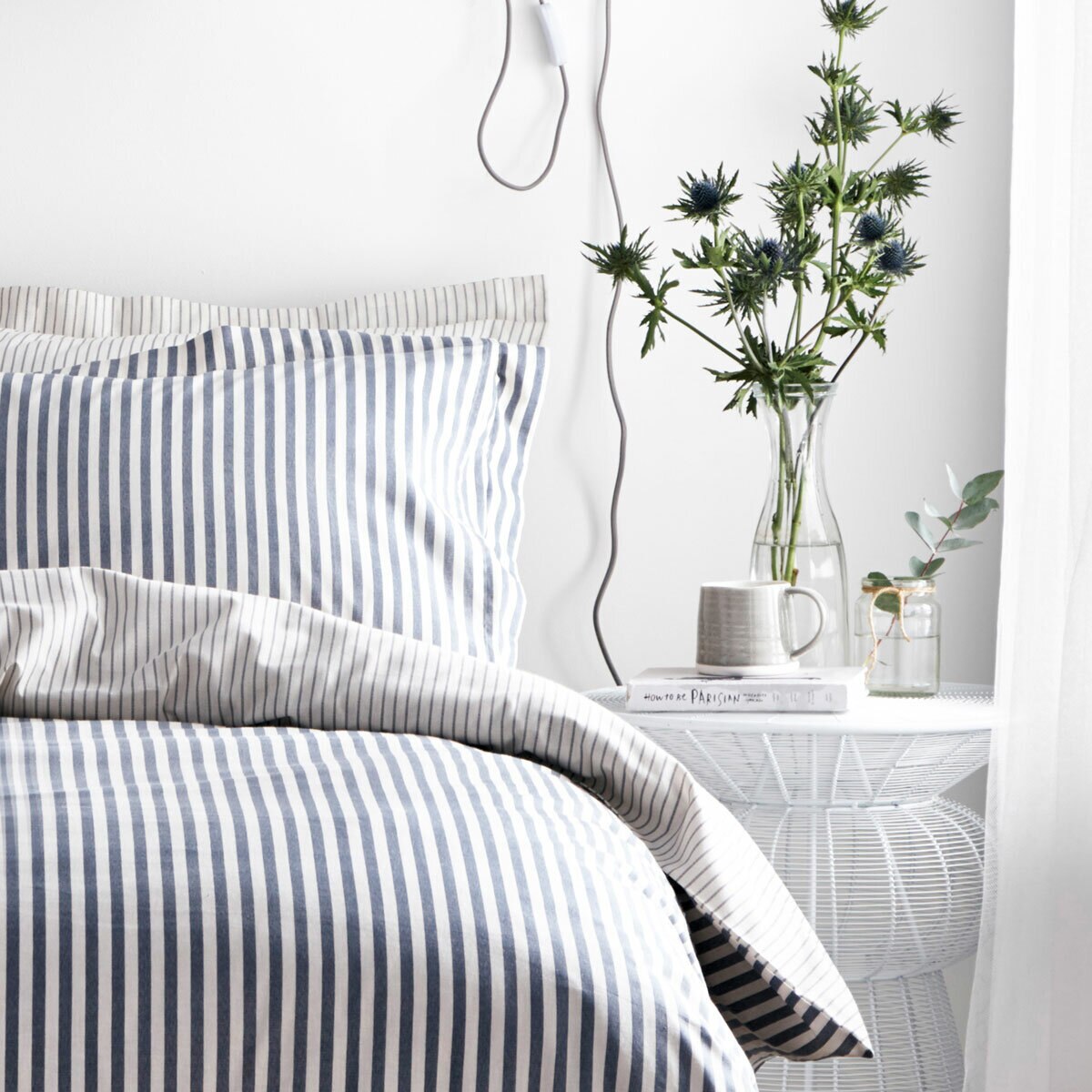 Blue and white vertically striped duvet set with matching