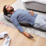 Lifestyle Image of Homedics Recline Shiatsu Massage Cushion of man lying on ground