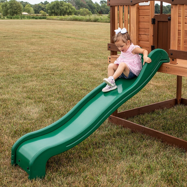Lifestyle image of a child going down the slide