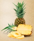 WHOLE PINEAPPLE WITH PINEAPPLE CUT IN HALF AND PINEAPPLE RINGS